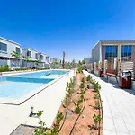 Luxury 1-Br Villa In Rukan: Dubai Skyline Views!